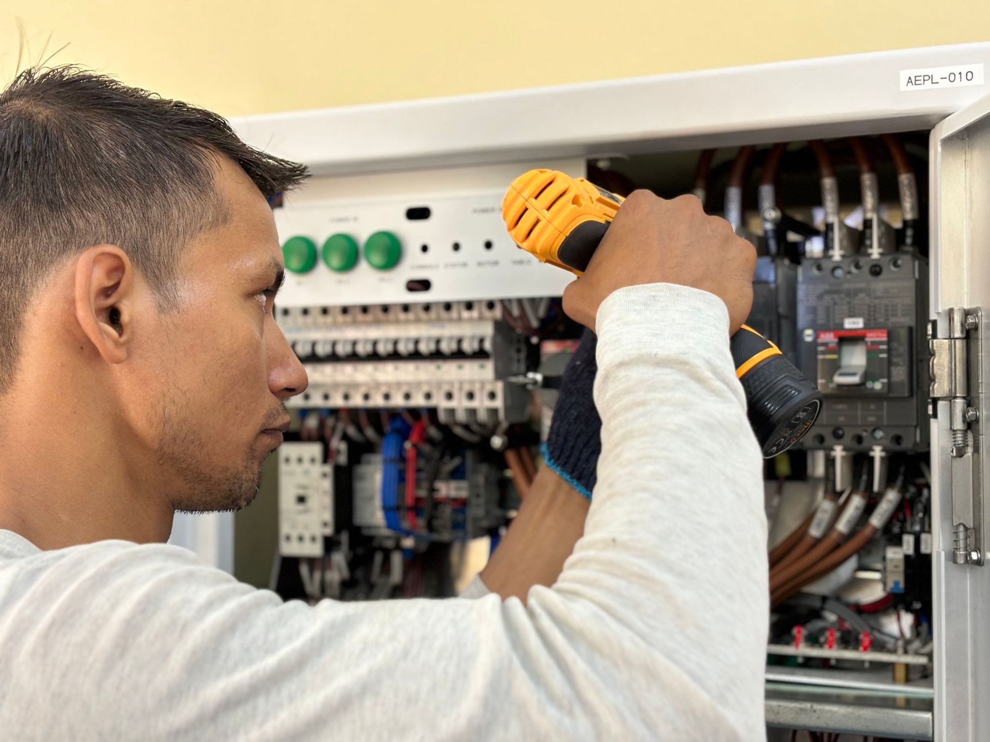 Electrician at work on a residential electrical panel